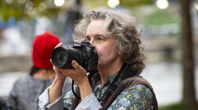 Pensioner card camera, photographer, woman